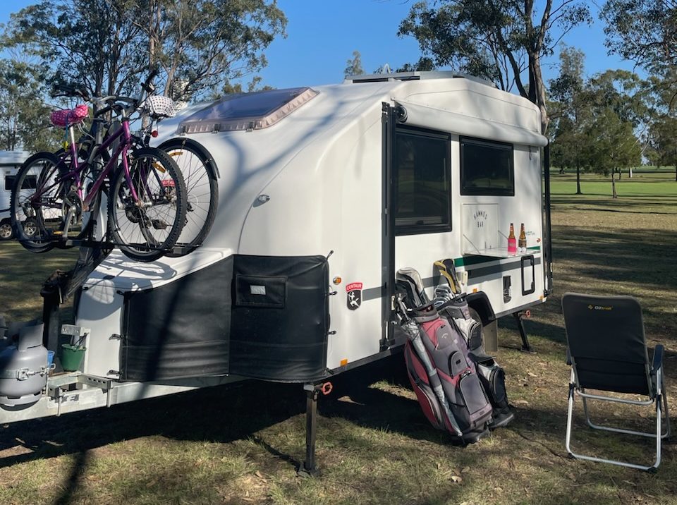 caravan loaded with golf clubs